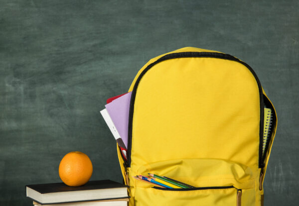 yellow-backpack-stack-books-orange