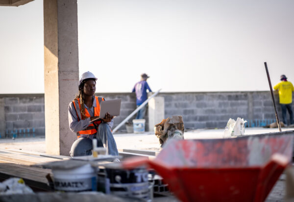 Engineer technician inspects building structure Engineer technicians are looking at and analyzing unfinished construction projects. In order to be in accordance with the design
